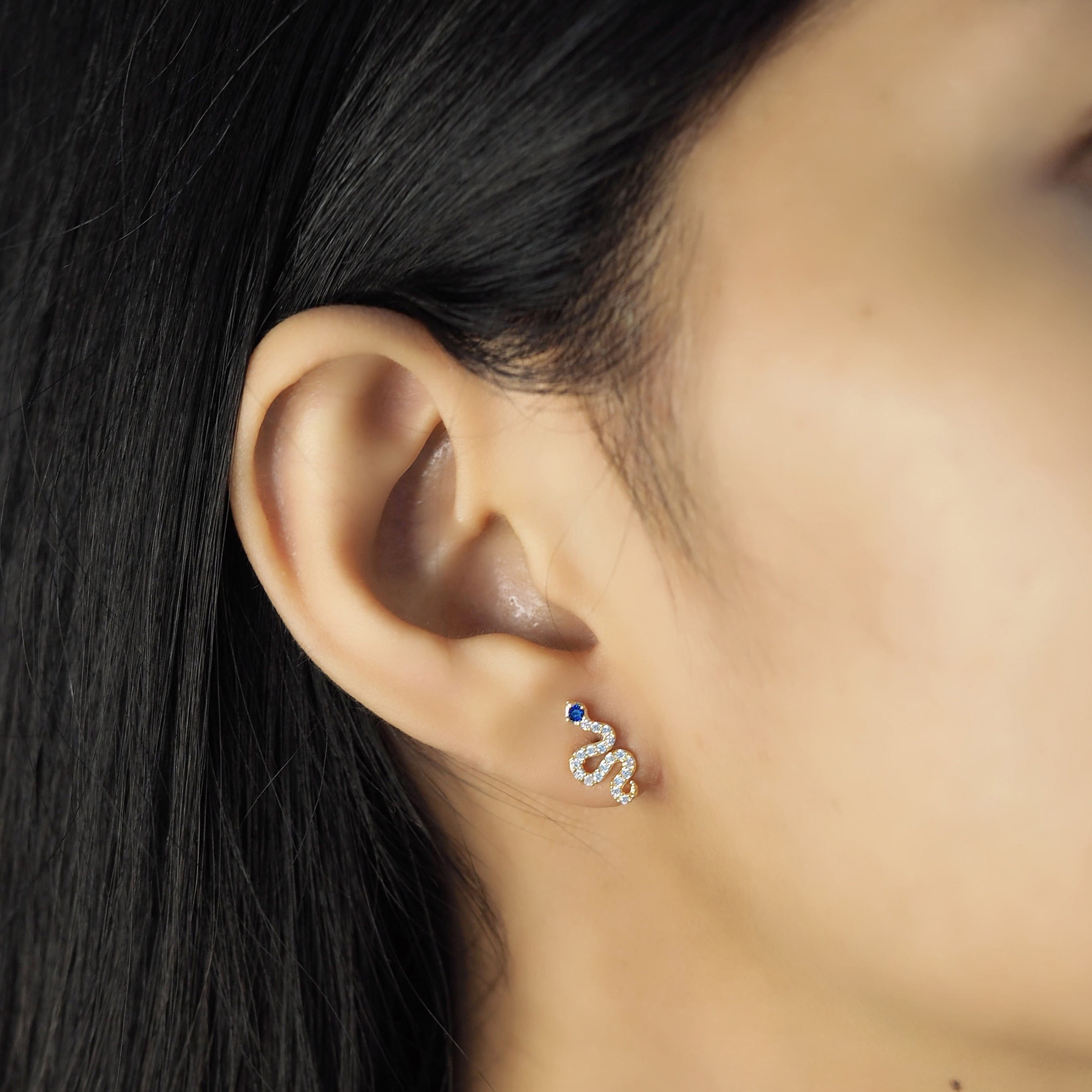 TAI JEWELRY | Pave CZ Snake Studs With Blue Montana Eyes | Earrings |